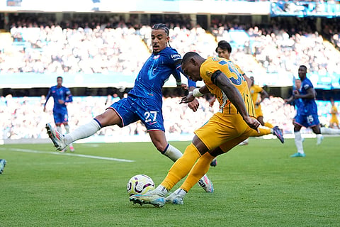 English Premier League 2024-25, Chelsea vs Brighton: Brighton's Pervis Estupinan, right and Chelsea's Malo Gusto vie for the ball 