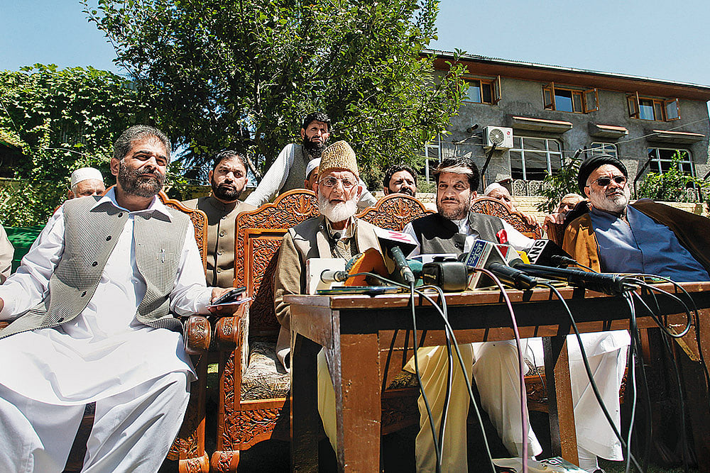 Photo: Getty Images : Chairman of hardline faction of Hurriyat, Syed Ali Shah Geelani, separatist leaders Nayeem Khan and Shabir Shah, and cleric Aga Syed Hassan at a 2015 press conference in Srinagar