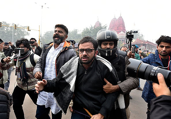 (Photo by K Asif/The India Today Group via Getty Images) : Umar Khalid with police men at the Constitution Club in New Delhi. Representational Image |