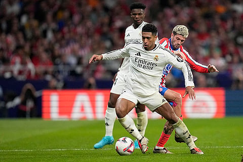 La Liga 2024-25 Atletico Madrid vs Real Madrid: Real Madrid's Jude Bellingham, left, and Atletico Madrid's Rodrigo De Paul fight for the ball 