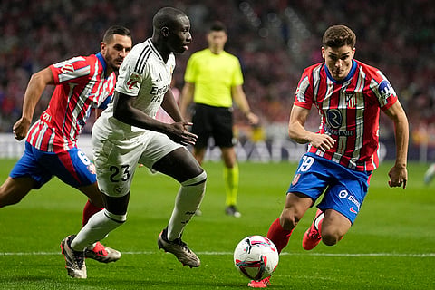 La Liga 2024-25 Atletico Madrid vs Real Madrid: Real Madrid's Ferland Mendy, left, and Atletico Madrid's Julian Alvarez fight for the ball 