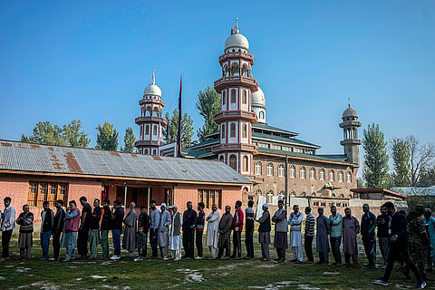 3rd phase of J&K polls: People queue up at a polling booth to cast their vote in north of Srinagar