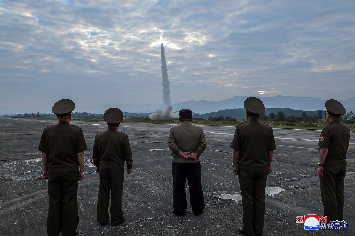 In this photo provided by the North Korean government, North Korean leader Kim Jong Un, center, oversees a launch of, what it says, the country’s newly built Hwasongpho-11-Da-4.5 ballistic missile at an undisclosed place in North Korea Wednesday, Sept. 18, 2024 - AP