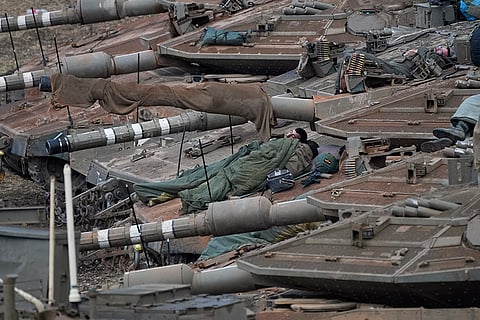 Mideast Tensions: Israeli soldiers sleep on tanks near the Israel-Lebanon border