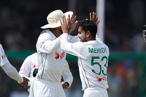 IND vs BAN, 2nd Test: Bangladesh's Mehidy Hasan Miraz, right, celebrates the wicket of India's captain Rohit Sharma 
