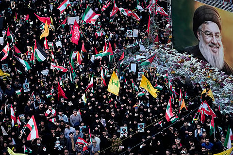 Mideast Tensions: Mourners attend a rally commemorating slain Hezbollah leader Hassan Nasrallah