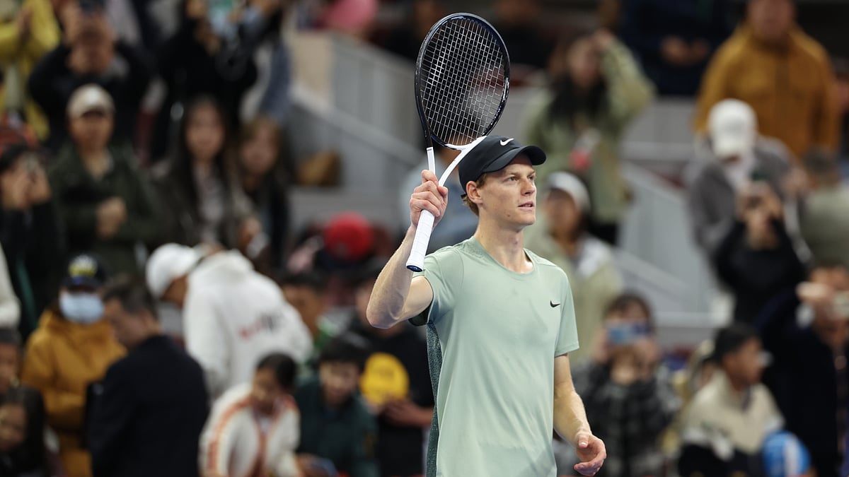 Jannik Sinner celebrates after converting match point