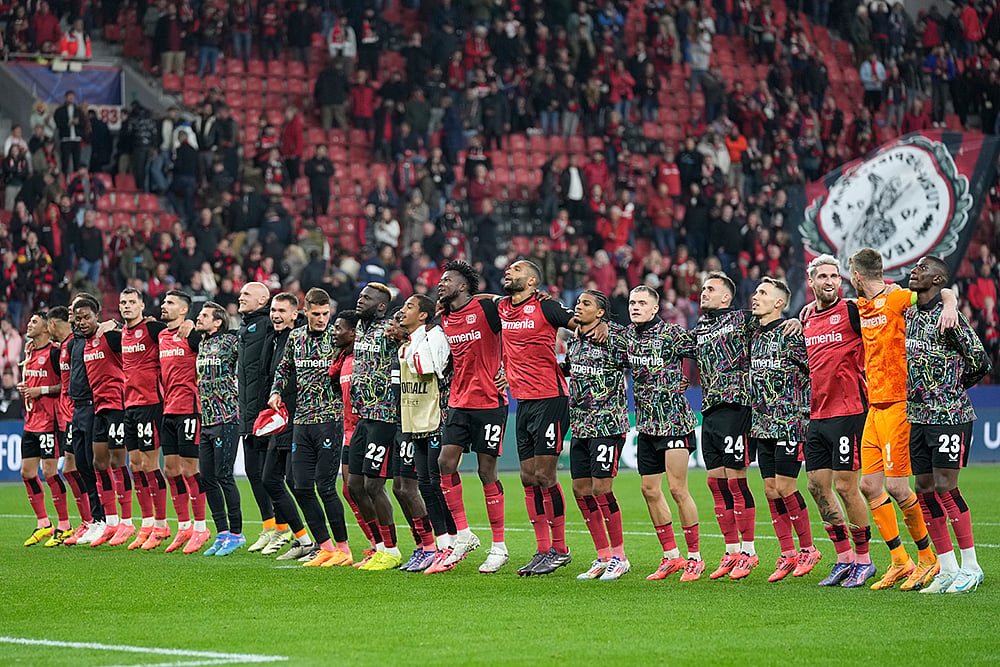 Photo: AP/Michael Probst : Bayer Leverkusen Vs AC Milan