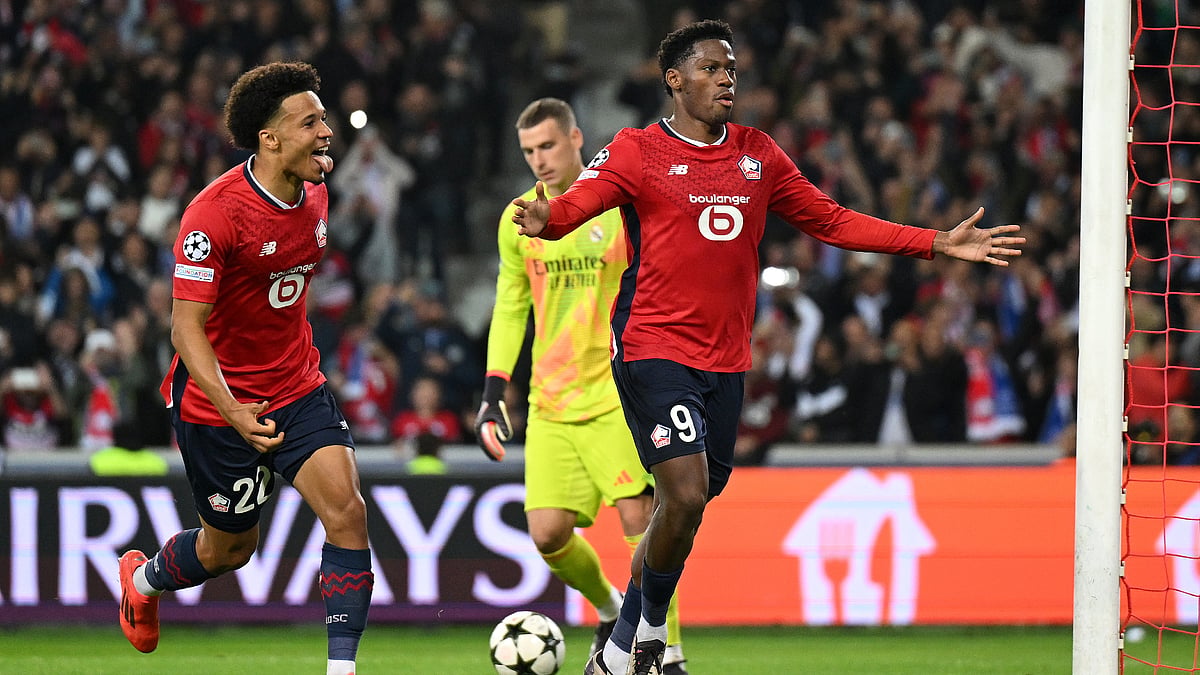 Jonathan David celebrates after scoring from the penalty spot against Real Madrid - null