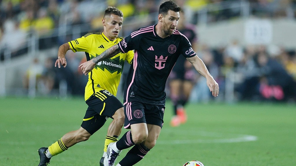 AP : Columbus Crew's Alexandru Matan, left, chases Inter Miami's Lionel Messi during the second half of an MLS soccer match, Wednesday, Oct. 2, 2024.
