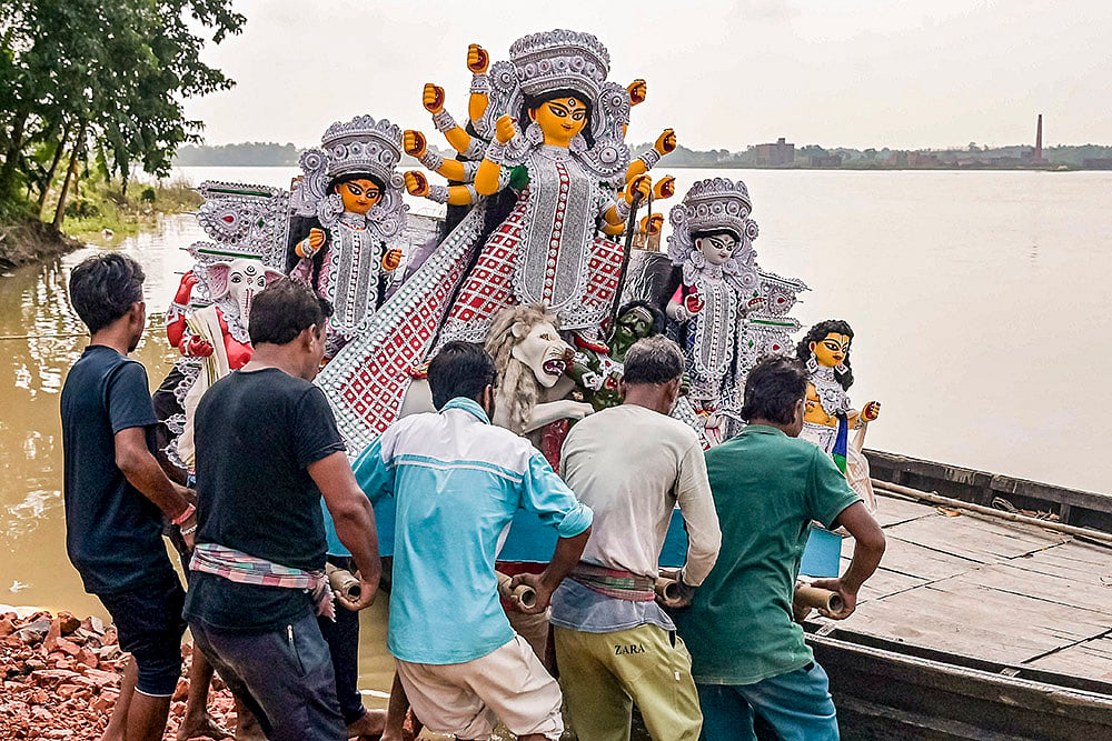 An idol of Goddess Durga being taken to puja pandal in Nadia