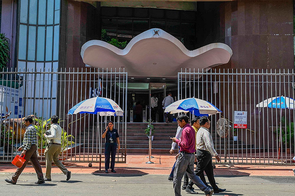People walk past the Bombay Stock Exchange (BSE) building, in Mumbai