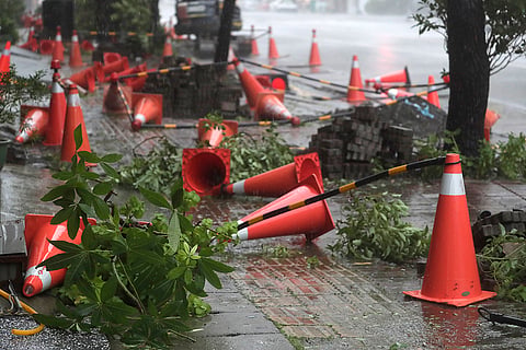 Taiwan Typhoon Krathon: Traffic cones litter the pavement 