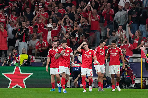 UCL 2024-25, Benfica vs Atletico Madrid: Benfica's Alexander Bah, right, is congratulated by teammates after scoring his sides third goal