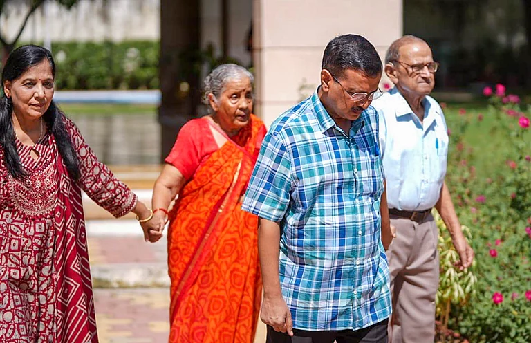 AAP National Convenor Arvind Kejriwal with his wife and parents leaves CM residence days after resigning from the chief minister's post, in New Delhi. - PTI