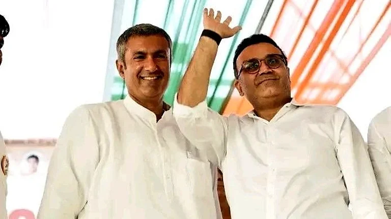 Virender Sehwag poses with Tosham constituency candidate Anirudh Chaudhary (left) - X