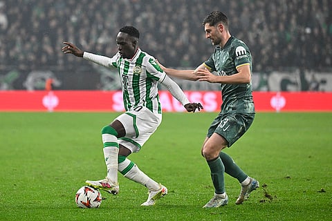UEFA Europa League 2024-25, Ferencvaros vs Tottenham Hotspur: Ferencvaros' Adama Traore, left, is challenged by Tottenham's Ben Davies 