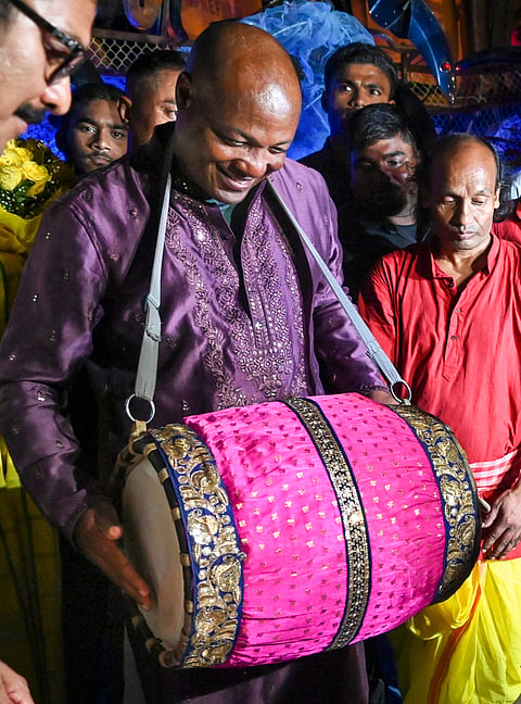 Kolkata: Former West Indies cricketer Brian Lara plays an instrument during his visit to a community puja pandal amid the Durga Puja festivities at Suruchi Sangha, in Kolkata, Sunday, Oct. 6, 2024.