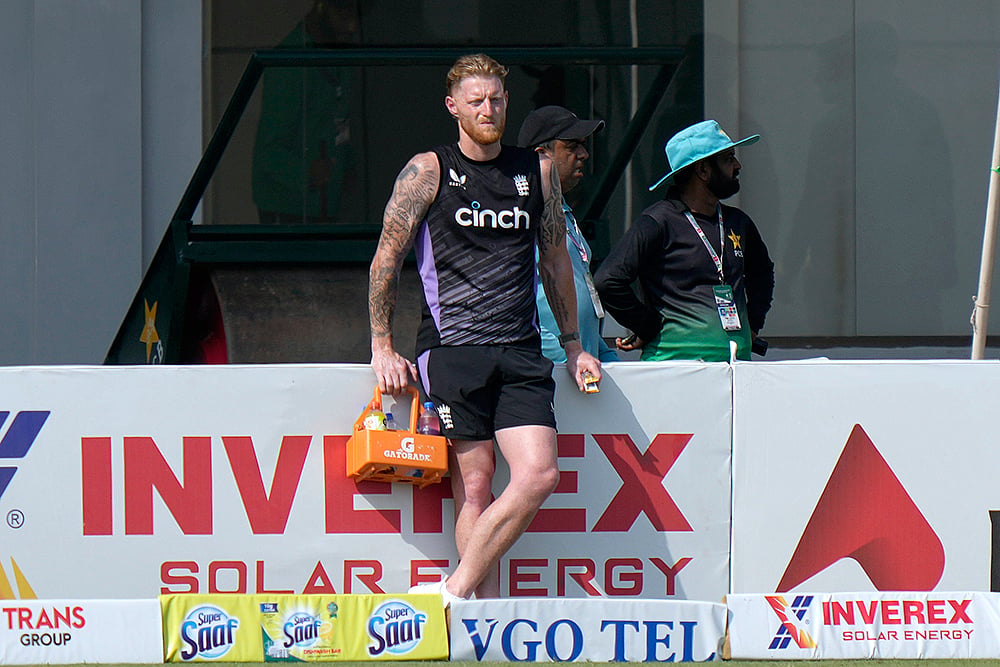 Englands Ben Stokes  serves drink against Pakistan in Multan