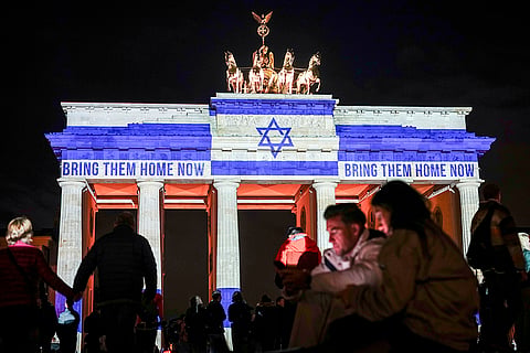 Mideast War Anniversary: Brandenburg Gate is illuminated with the flag of Israel