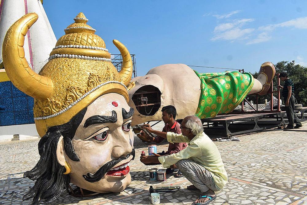 Artists prepare an effigy of the demon king Ravana