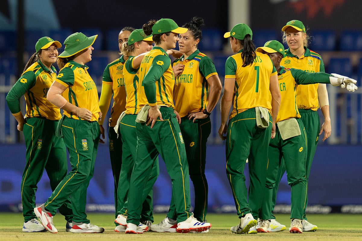 (AP Photo/Altaf Qadri) : South African players celebrate the wicket of England's Maia Bouchier during the ICC Women's T20 World Cup 2024 match between England and South Africa at Sharjah Stadium, United Arab Emirates, Monday, Oct. 7, 2024. 