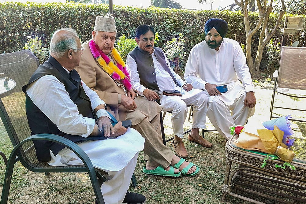 Farooq Abdullah with J-K Congress President Tariq Hameed Karra in Srinagar
