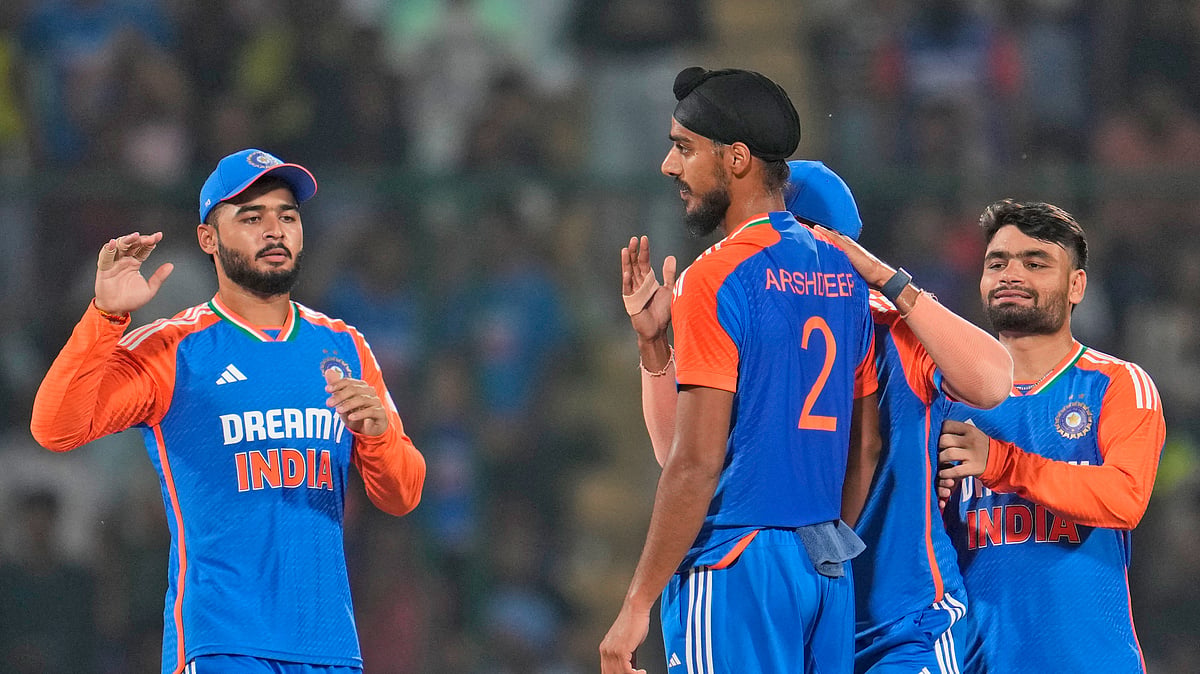 Manish Swarup/AP : India celebrate Parveez Hossain's wicket in the second T20I