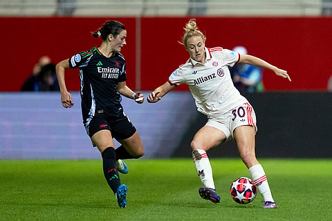 Women's Champions League: Munich's  Carolin Simon, right, and Arsenal's Emily Fox, left, challenge for the ball 