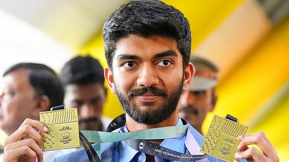 D Gukesh welcomed at Chennai Airport - Photo: PTI/R Senthilkumar