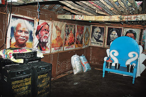 Posters of iconic leaders worshipped by the Gond tribe decorate the walls of the ghotul at Kamalpur