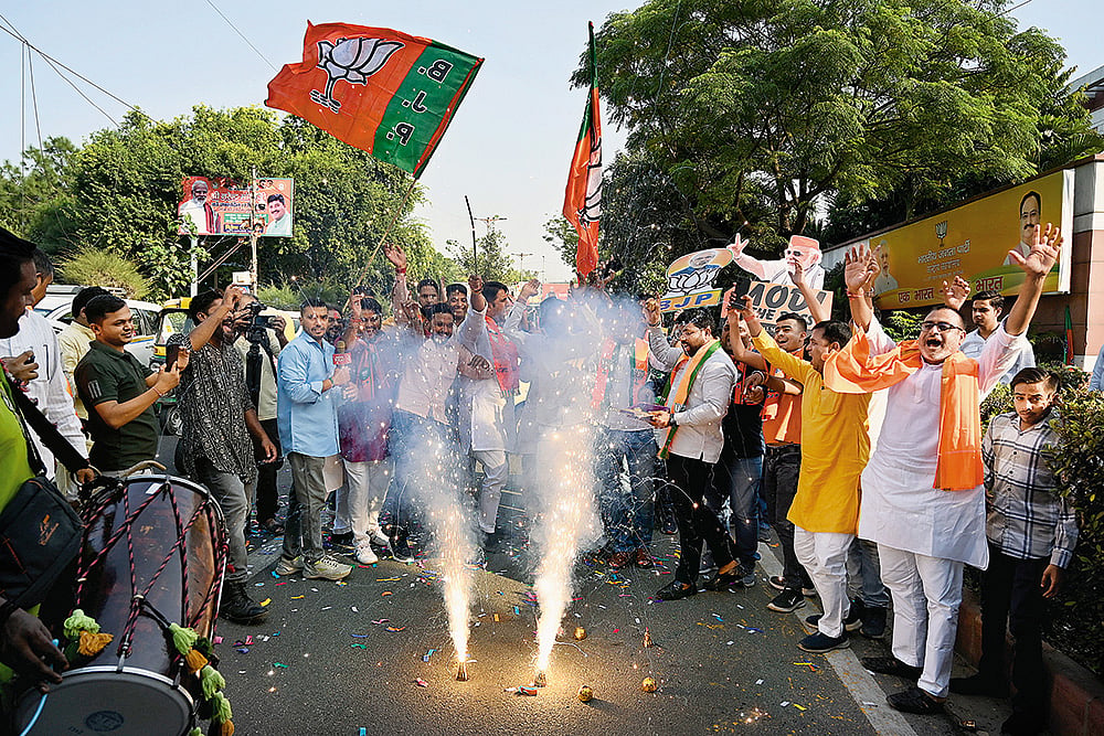 A Stunning Win: BJP supporters celebrating after 
winning the Haryana 
assembly election - Photo: Getty Images