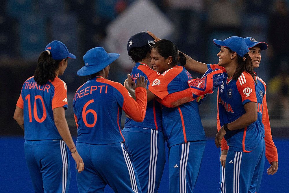 | Photo: AP/Altaf Qadri : Women's T20 WC:  Richa Ghosh centre, after she took a catch to dismiss Sri Lanka's Sugandika Kumari