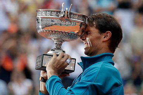 Rafael Nadal holds the trophy as he celebrates winning 2018 French Open tennis tournament 