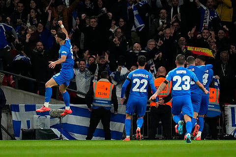 Nations League Soccer: Greece's Vangelis Pavlidis, right, celebrates with teammates after scoring the opening goal