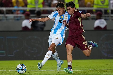 FIFA World Cup 2026 Qualifiers: Argentina's Nahuel Molina, left, and Venezuela's Jon Aramburu vie for the ball 