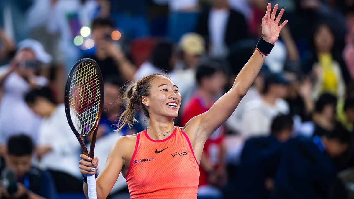 Zheng Qinwen celebrates after converting match point against Jasmine Paolini - null