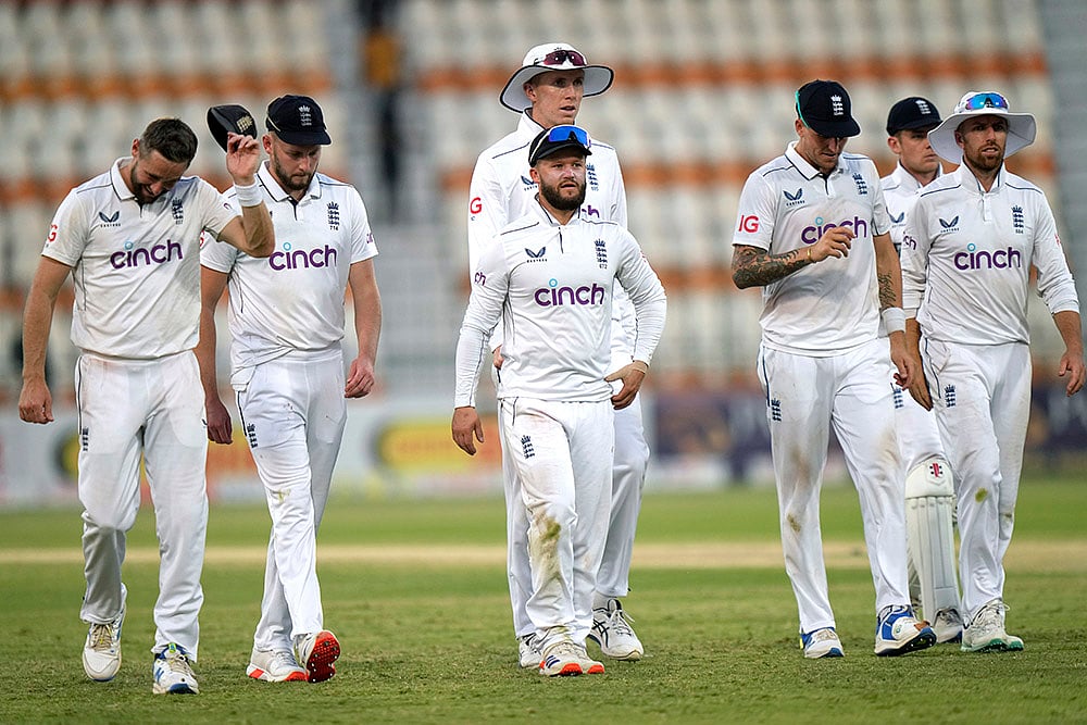 Pakistan vs England: England's Ben Duckett, centre, and teammates walk off the field on the end of fourth day - | Photo: AP/Anjum Naveed