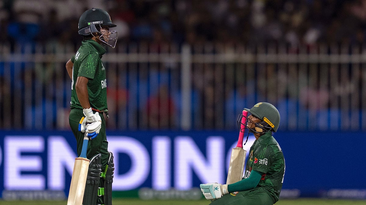 AP Photo/Altaf Qadri : Bangladesh's Sobhana Mostary, right, sits on the pitch as she reacts after losing her wicket during the ICC Women's T20 World Cup 2024 match between England and Bangladesh at Sharjah Stadium.