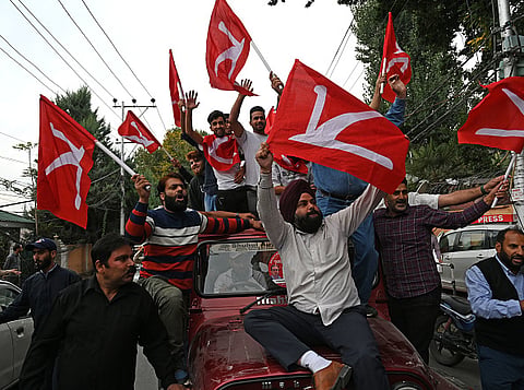 Supporters of National Conference (NC) celebrate on October 8, 2024 in Srinagar.