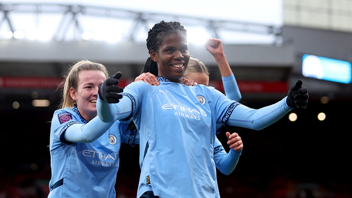 Khadija Shaw celebrates at Anfield on Sunday with her Manchester City team-mates