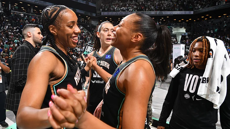 Kayla Thornton (left) and Betnijah Laney-Hamilton of the New York Liberty celebrate the team's win in Game 2 of the 2024 WNBA Finals. - null