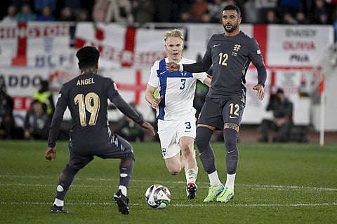 Nations League Soccer: England's Angel Gomes, left, and Kyle Walker, right, challenge for the ball with Matti Peltola of Finland