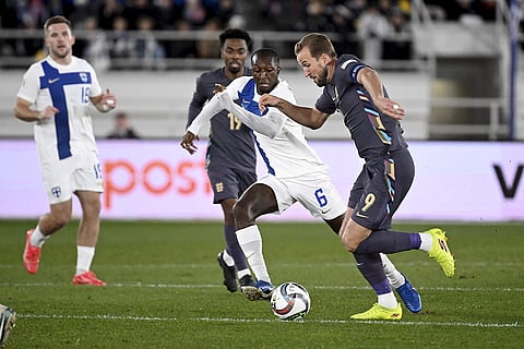 Nations League Soccer: Finland Glen Kamara, centre, challenges for the ball with England's Harry Kane