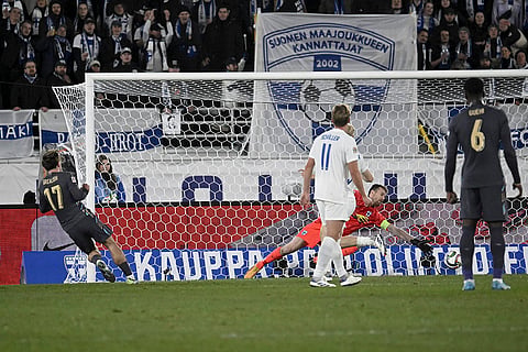 Nations League Soccer: Jack Grealish of England, left, scores the opening goal past Finland's goalkeeper Lukas Hradecky