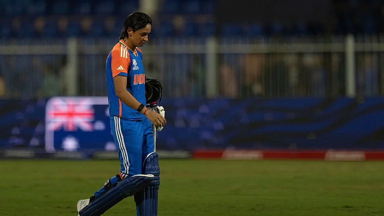 A dejected Harmanpreet Kaur walks off the field after losing to Australia during the ICC Women's T20 World Cup 2024 match at Sharjah Stadium. - AP