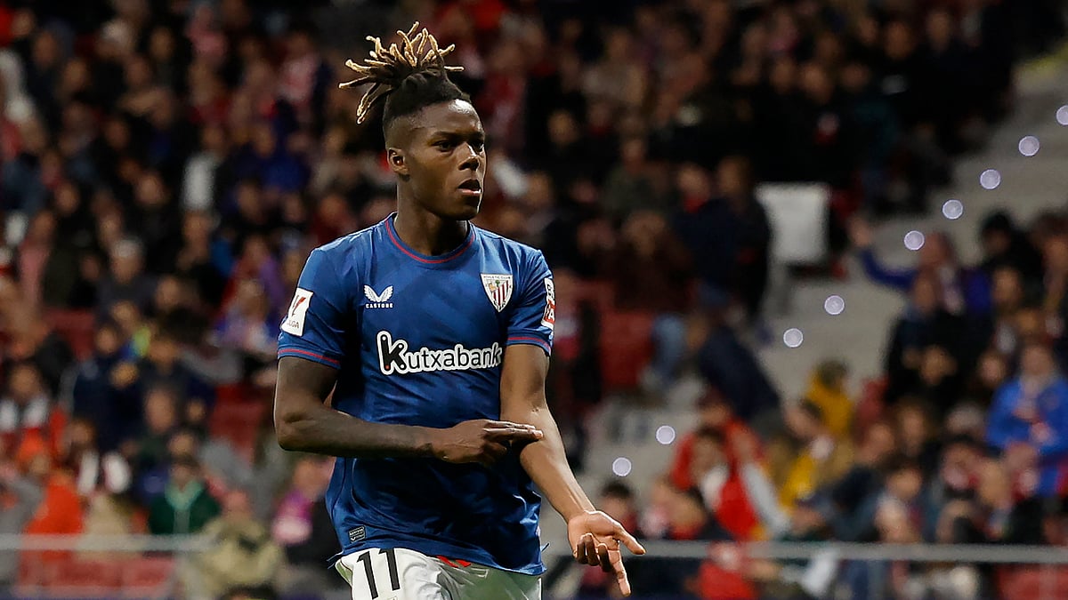 Nico Williams points to his skin after scoring at Atletico Madrid last season - null