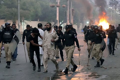 Police detain a Tehreek-e-Labbaik Pakistan supporter