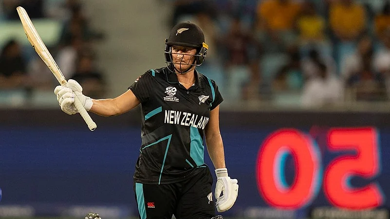 Sophie Devine celebrates her fifty runs