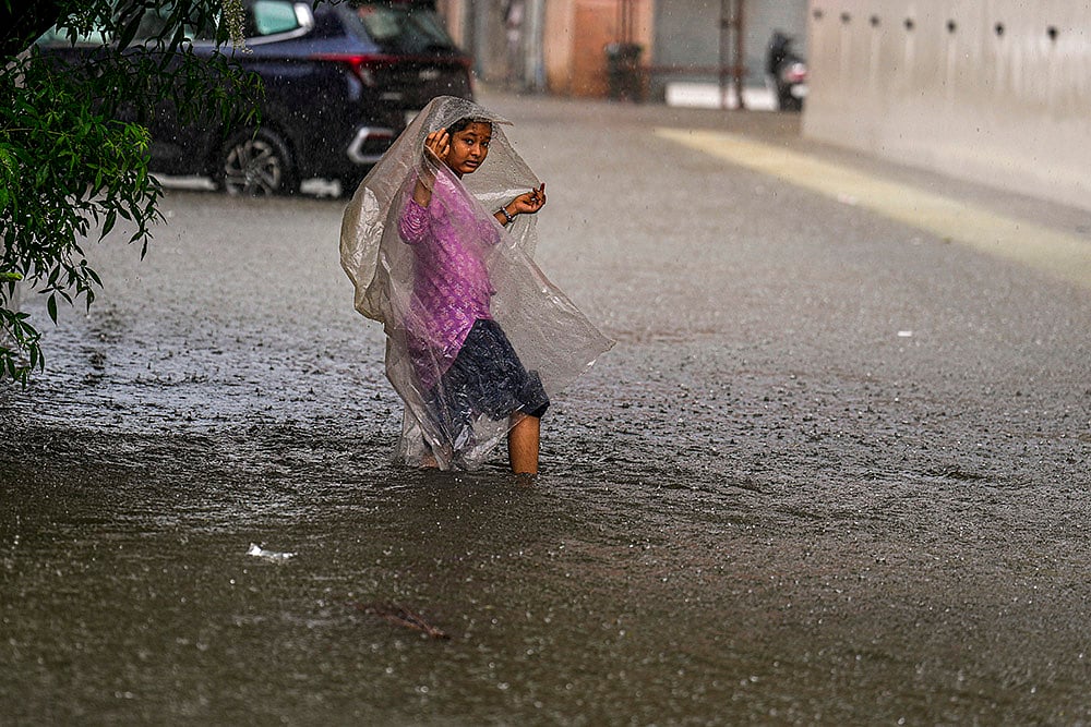 | Photo: PTI/R Senthilkumar : Chennai Rains: Waterlogged road in Chennai